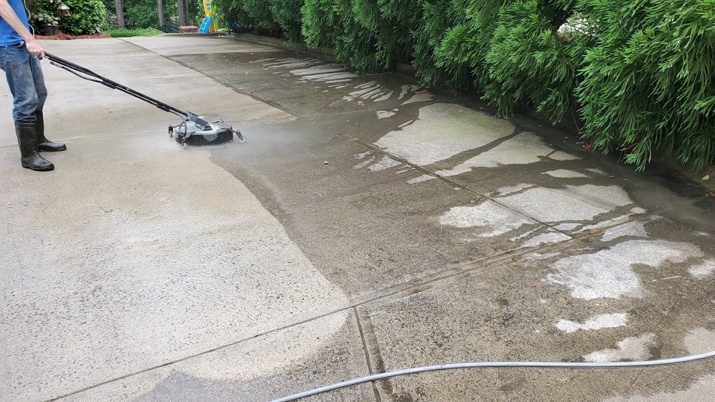 Pressure washing a driveway